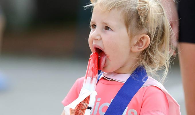 Child enjoying ice-cream.