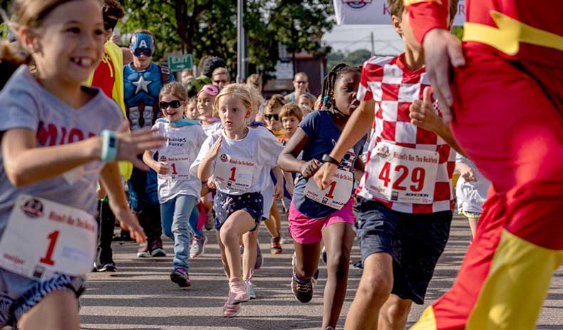 Kids racing with the Flash in the MRTR Kids K Fun Run.